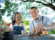 In the pottery workshop, an Asian retired couple is engaged in p