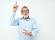 Senior grey haired man in shirt and glasses posing emotions isolated background