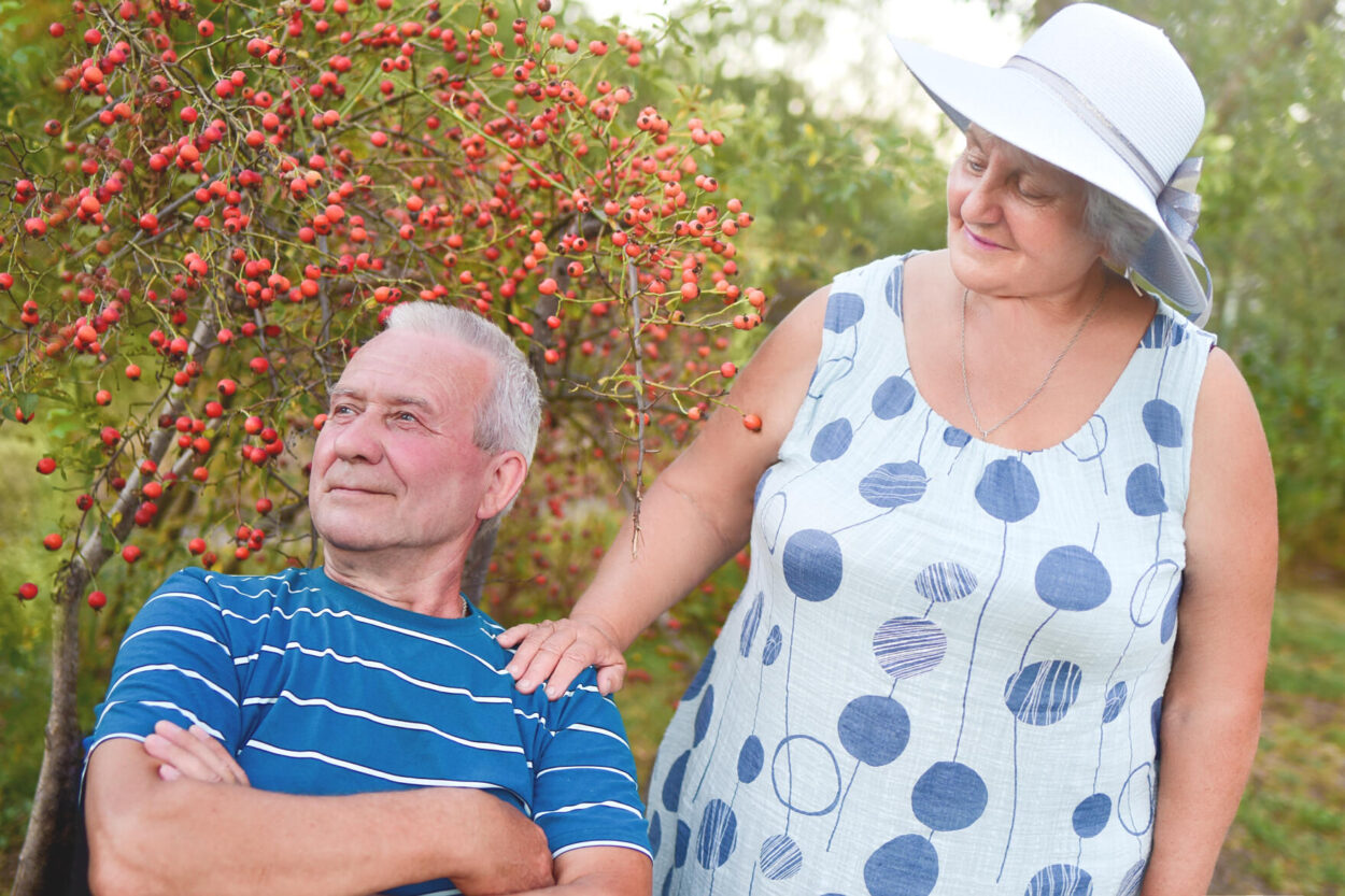 Happy senior couple enjoying each other in the park. Support and care from a loved one. love concept