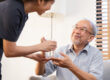 Asian young woman caregiver, carer supporting elderly, aged pati