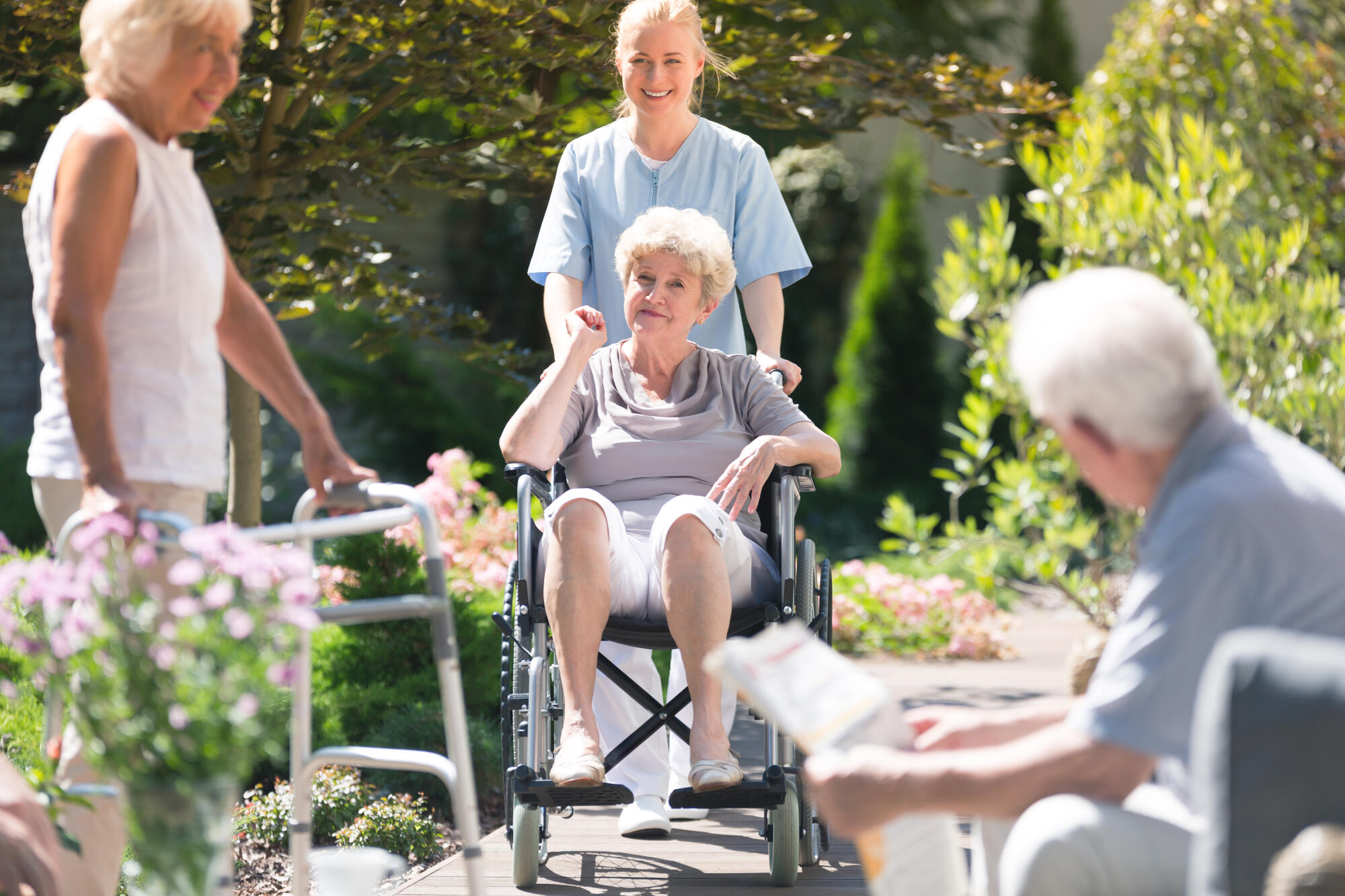 Smiling,Senior,Woman,In,A,Wheelchair,Spending,Time,With,Her Smiling,Senior,Woman,In,A,Wheelchair,Spending,Time,With,Her
