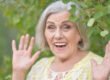 Portrait of a beautiful elderly woman in the park