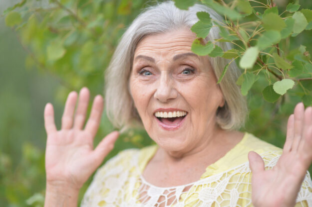 Portrait of a beautiful elderly woman in the park Portrait of a beautiful elderly woman in the park