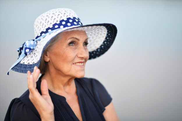 Portrait of a senior woman in summer near lake Portrait of a senior woman in summer near lake