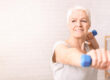 Woman Holding Two Blue Dumbbells, Copy Space