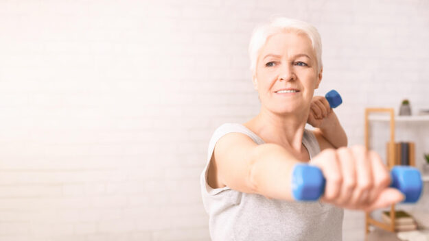 Woman Holding Two Blue Dumbbells, Copy Space