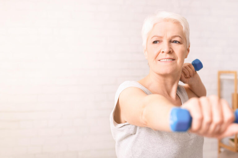 Woman Holding Two Blue Dumbbells, Copy Space Woman Holding Two Blue Dumbbells, Copy Space