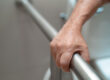 Asian elderly woman patient use toilet bathroom handle security