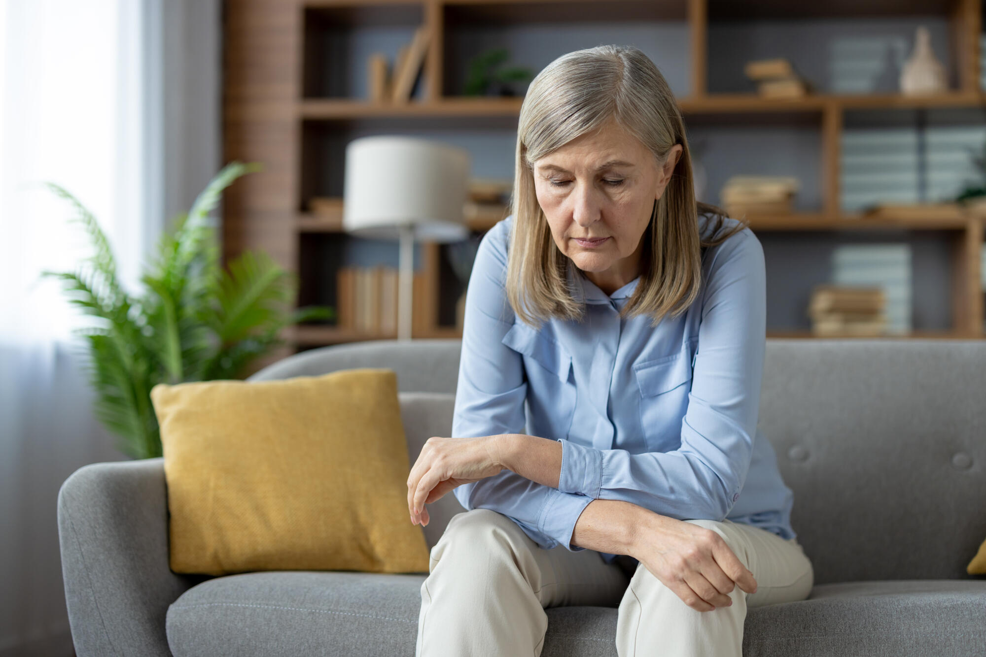 Senior woman feeling sad and lonely at home
