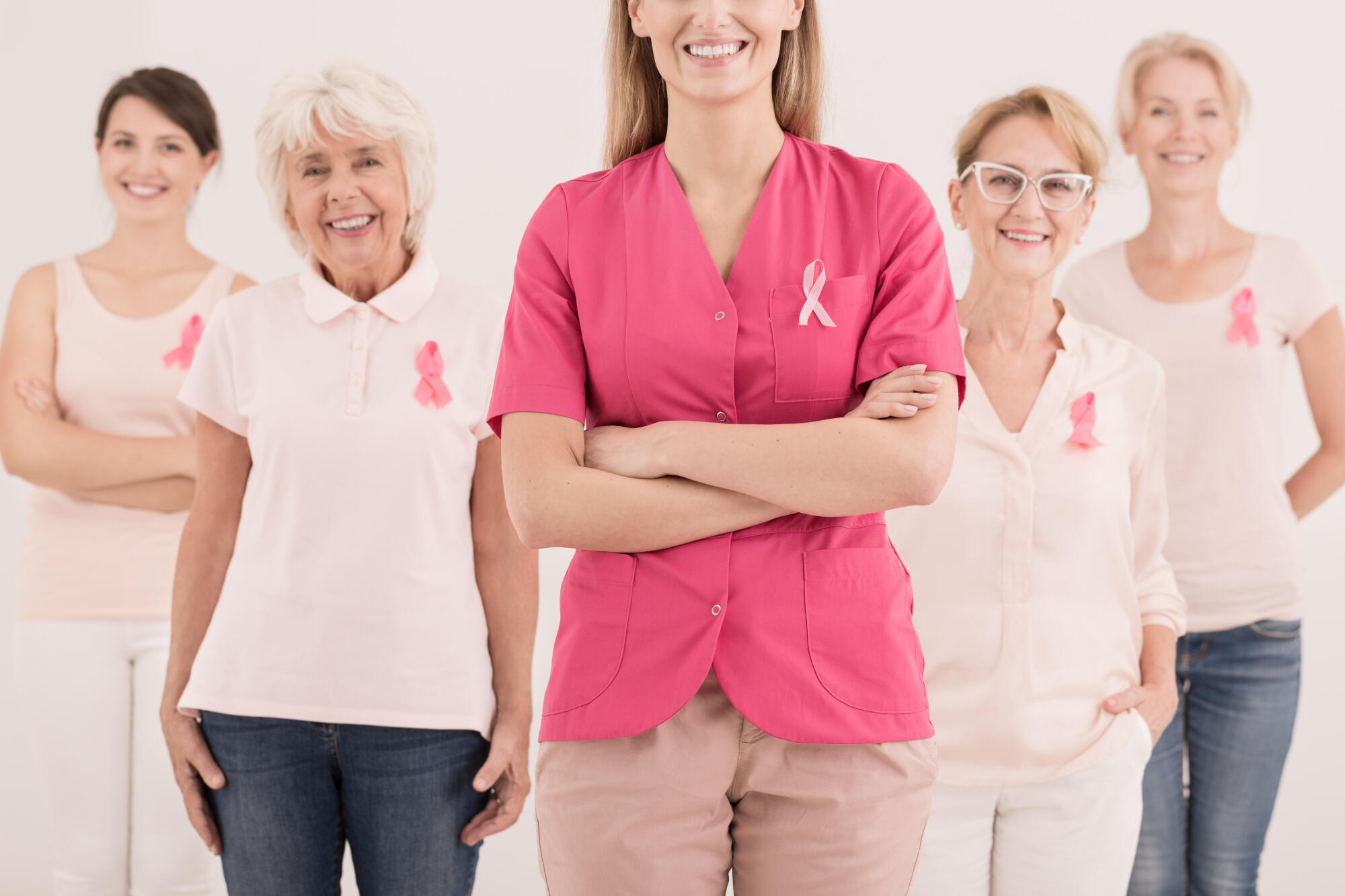 Close,Up,On,A,Pink,Ribbon,On,Shirt,Of,Young