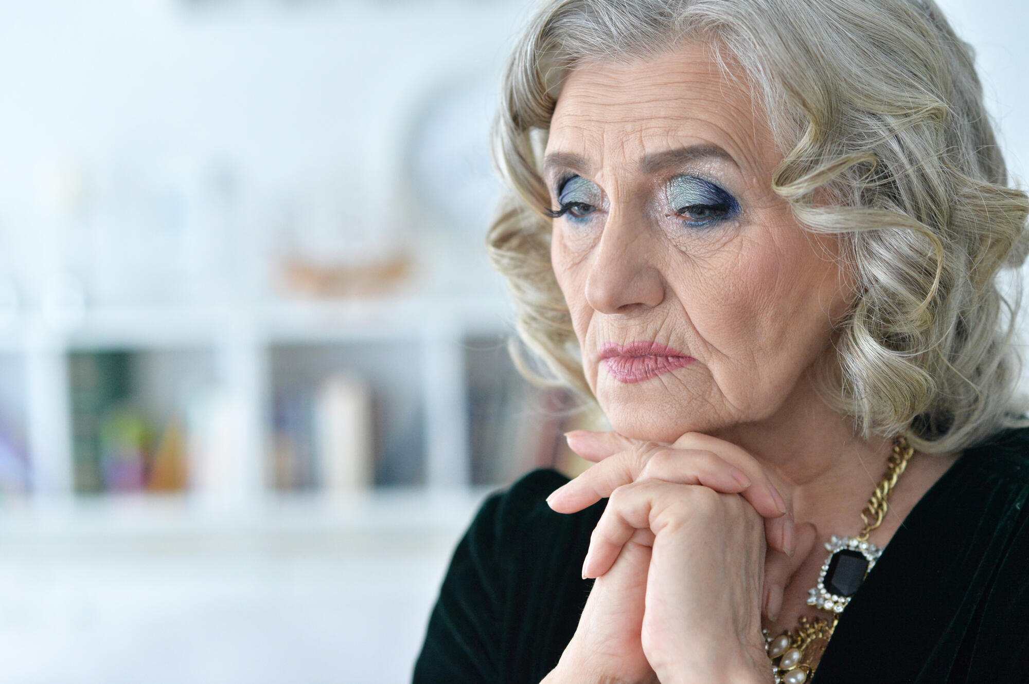 Close up portrait of sad senior woman