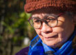 Portrait of a happy senior woman smiling and looking down while