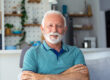 close up portrait of happy senior man looking at camera