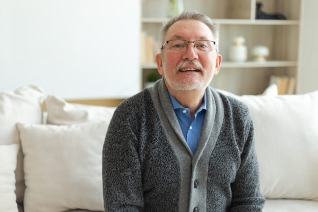 Confident stylish middle aged senior man at home. Older mature 70s man smiling. Happy attractive senior beard grandfather looking camera close up face headshot portrait. Happy people. Confident stylish middle aged senior man at home. Older mature 70s man smiling. Happy attractive senior beard grandfather looking camera close up face headshot portrait. Happy people.