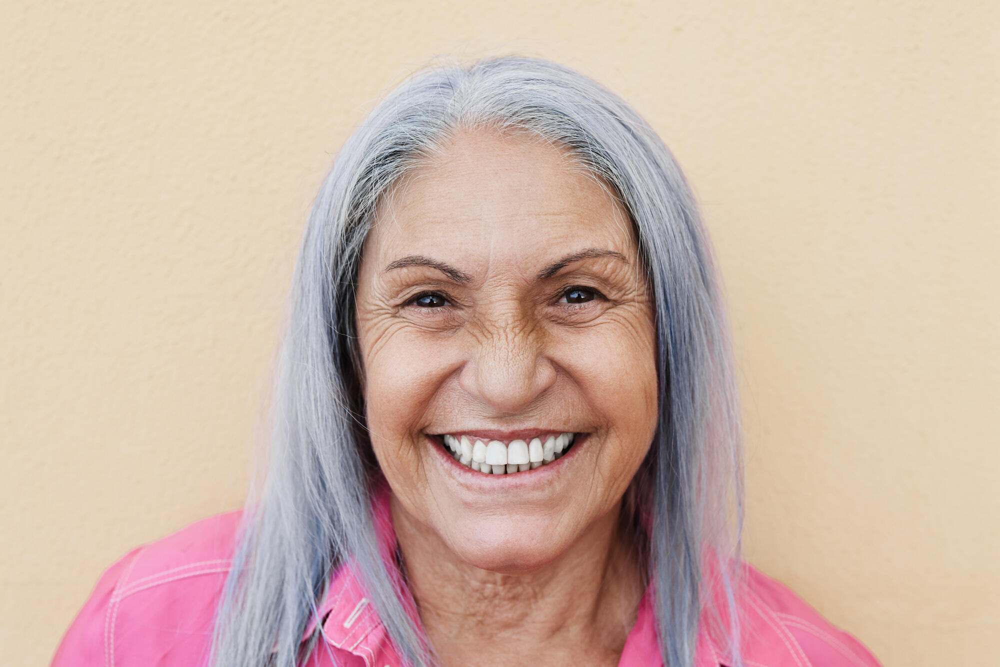 Portrait,Of,Happy,Senior,Woman,Smiling,On,Camera,Outdoors,With