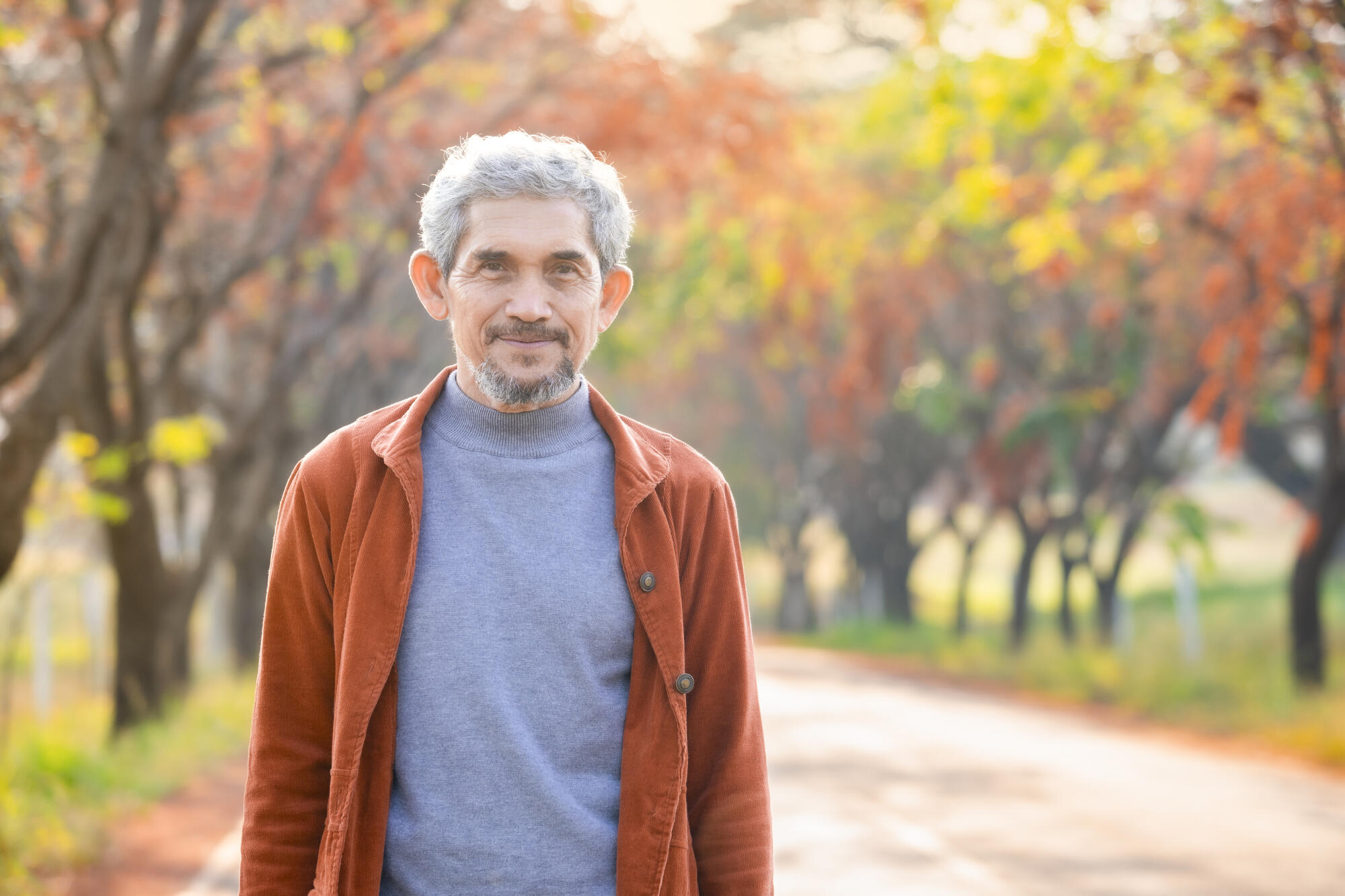 portrait healthy senior man walking along the street outdoors in autumn portrait healthy senior man walking along the street outdoors in autumn