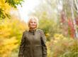 Senior citizen stroll in a park in autumn