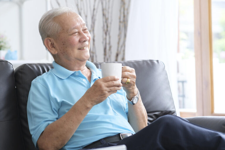 Senior man reading book and stay alone at home.