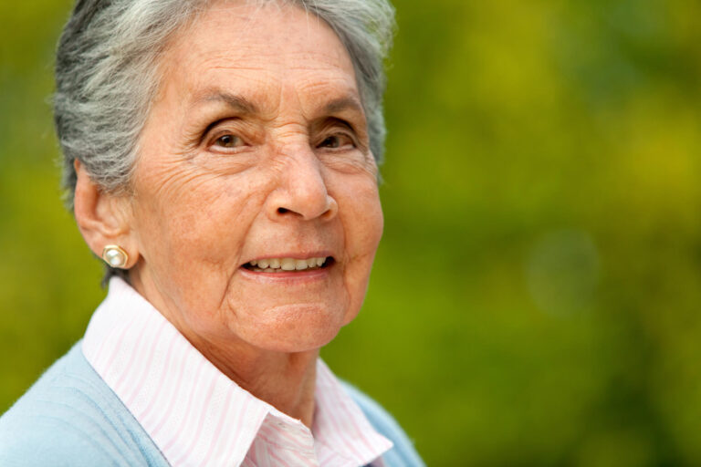 Portrait,Of,A,Lovely,Elder,Woman,Smiling,Outdoors