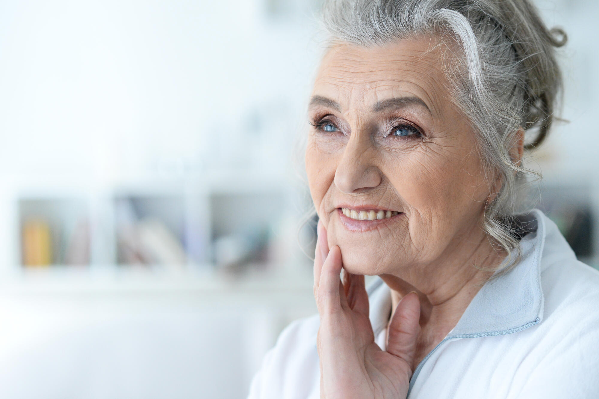 Portrait of happy senior woman posing at home