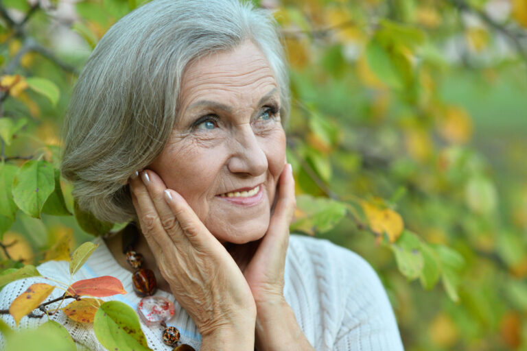 Portrait of senior woman in summer park