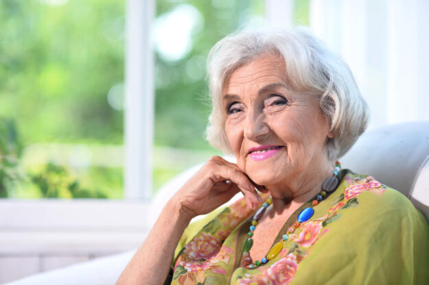 Portrait of a beautiful woman in the park in summer