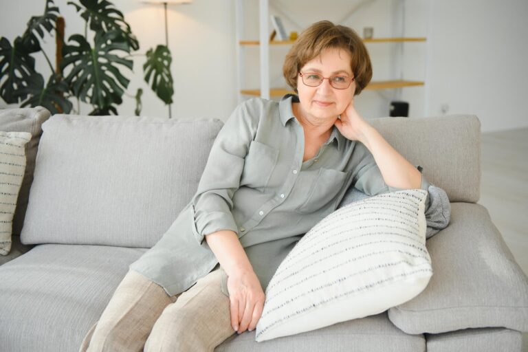 Closeup portrait of older woman wearing glasses.