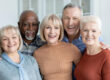 Portrait of multiracial group of senior people friends posing together