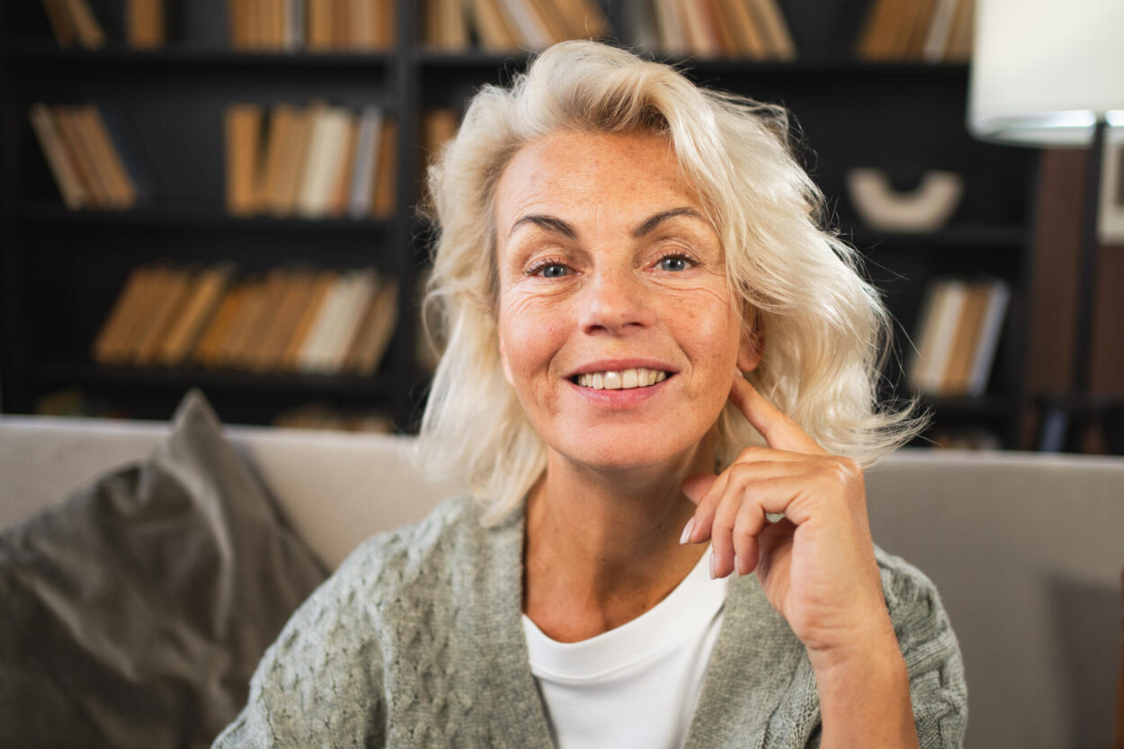 Portrait of confident stylish European middle aged senior woman. Older mature 60s lady smiling at home. Happy attractive senior female looking camera close up face headshot portrait. Happy people.