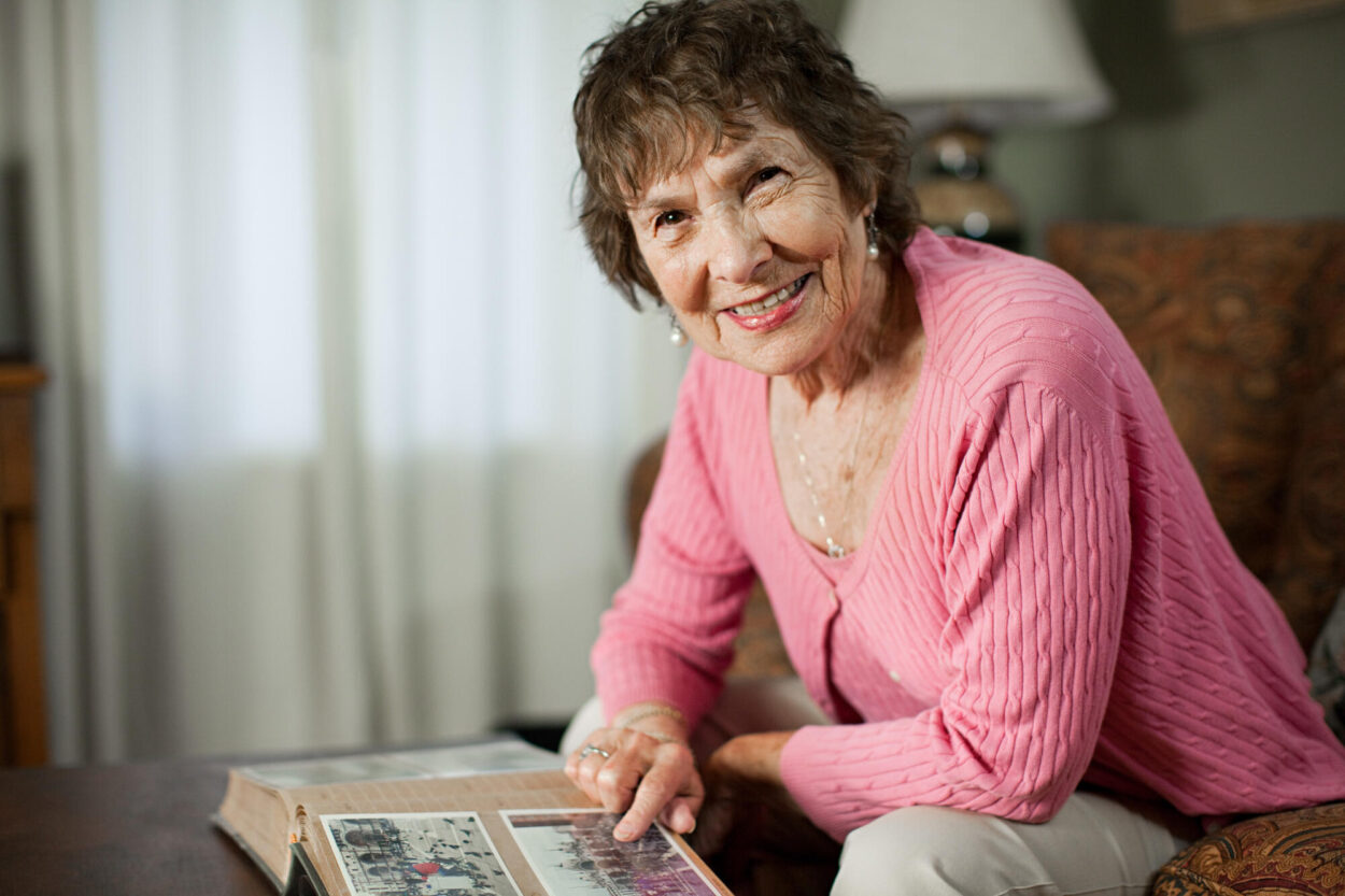 Senior,Woman,With,Family,Album