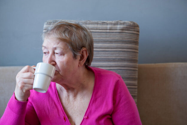 Seriously,Ill,Elderly,Woman,In,Pink,Blouse,Is,Sitting,On Seriously,Ill,Elderly,Woman,In,Pink,Blouse,Is,Sitting,On