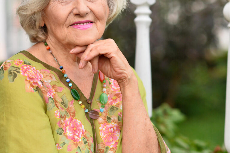 Portrait of a beautiful woman in the park in summer