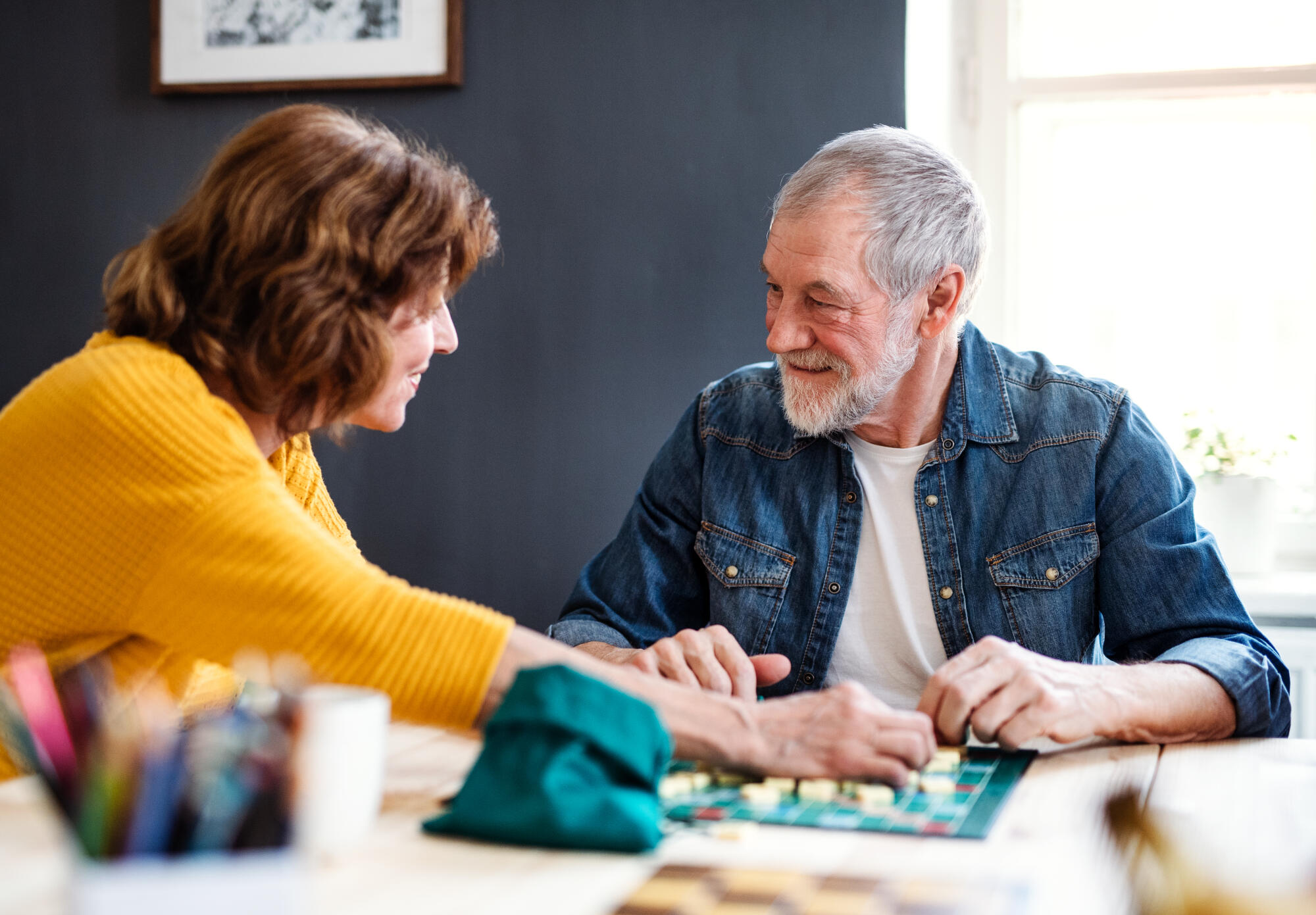 Senior,Couple,Playing,Board,Games,In,Community,Center,Club.