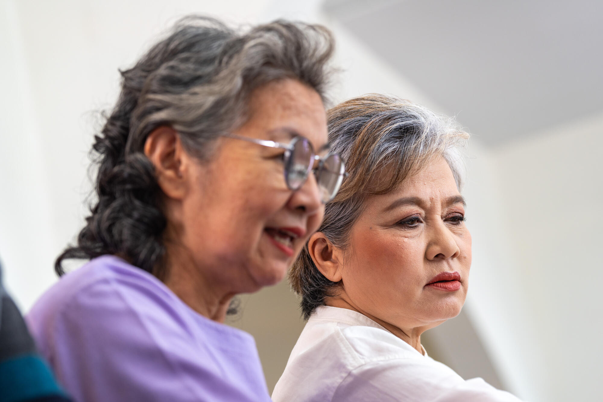 close up senior females and male sitting on bench. older people close up senior females and male sitting on bench. older people