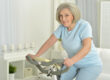 Elderly woman exercising on an exercise bike