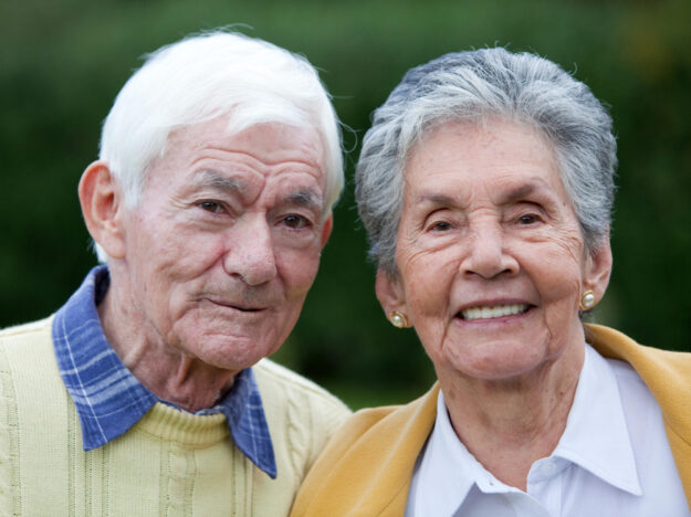 Portrait,Of,A,Beautiful,Elder,Couple,Smiling,Outdoors