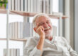Portrait of smiling senior man relaxing and enjoying in living r