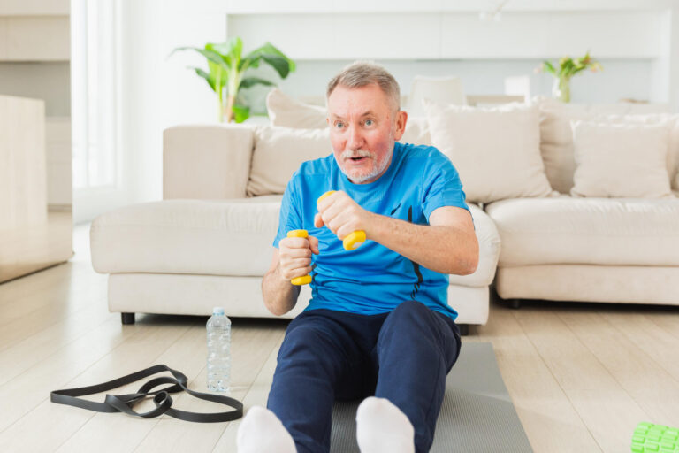 Fitness workout training. Senior man boxing punching picking up dumbbells. Old adult mature healthy man doing sports exercise at home. Grandfather have workout rehabilitation. Health care healthy lifestyle.