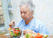 Asian senior woman patient eat (1)