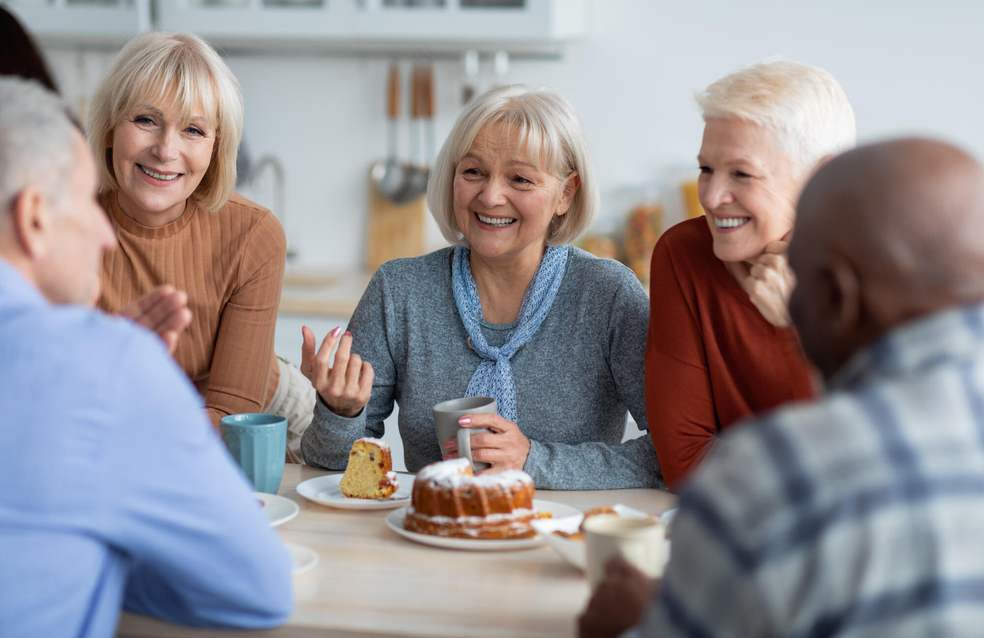 Healthy and active senior people drinking tea together