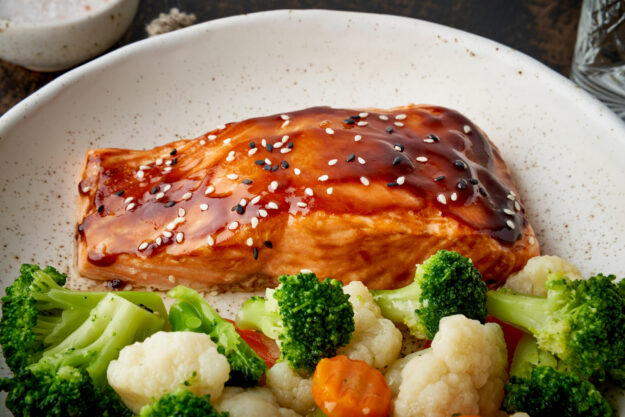 Steam salmon and vegetables, Paleo, keto, fodmap, dash diet. Mediterranean food with steamed fish. Steam salmon and vegetables, Paleo, keto, fodmap, dash diet. Mediterranean food with steamed fish.