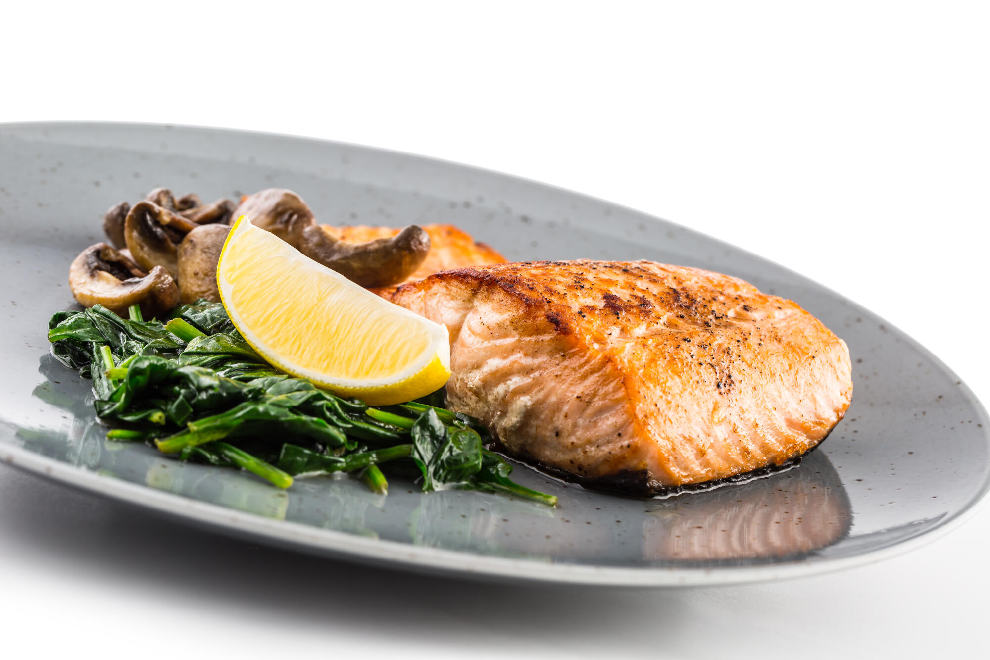 Salmon Roast Fillet. Portion of roast salmon fillet with spinach Salmon Roast Fillet. Portion of roast salmon fillet with spinach